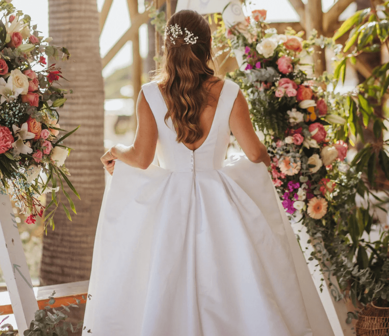 Bride walking through floral décor