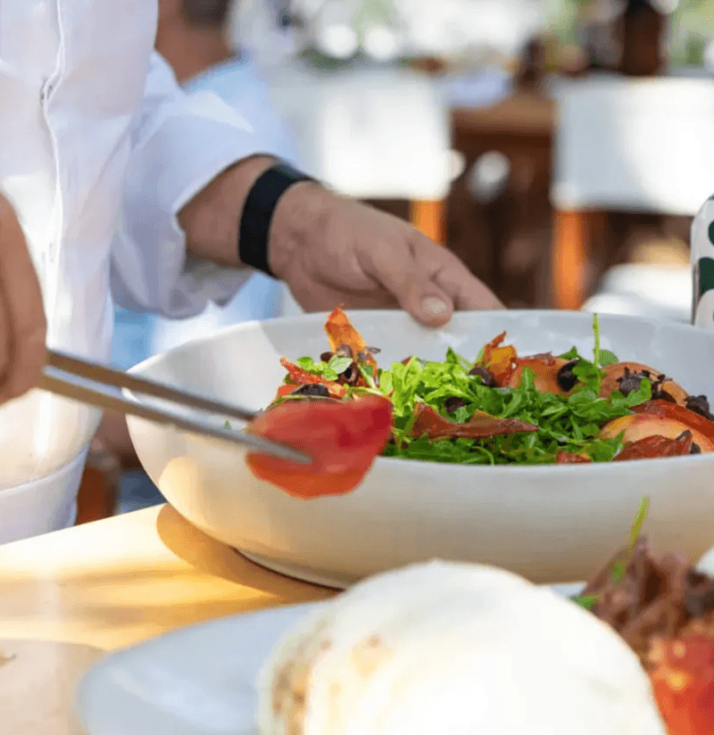 Chef plating a fresh seafood dish